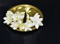 Brass metal plate decorated with jasmine flowers and aroma incense Royalty Free Stock Photo