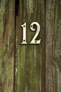 Brass number twelve on door