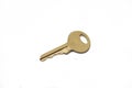 A brass padlock key isolated on a white background Royalty Free Stock Photo