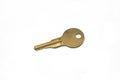 A brass padlock key isolated on a white background Royalty Free Stock Photo