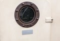 Brass porthole - ferry window frame Royalty Free Stock Photo