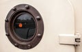 Brass porthole - ferry window frame Royalty Free Stock Photo