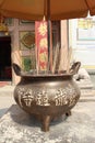 Brass Pot as an incense holder in front of the entrance of the Chinese Temple Royalty Free Stock Photo