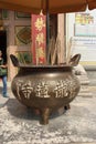 Brass Pot as an incense holder in front of the entrance of the Chinese Temple Royalty Free Stock Photo