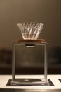 Brass pour over coffee stand with a glass dripper