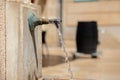 A brass public faucet in the Spanish city of Alicante. Royalty Free Stock Photo