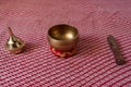 A brass resin burner and a singing bowl