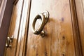 Brass ring knocker on old wooden door Royalty Free Stock Photo