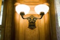 Brass sconces on a wooden wall Royalty Free Stock Photo