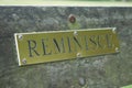 A brass sign saying `reminisce` Royalty Free Stock Photo