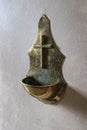 A brass stoup for holy water