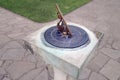 Brass sundial on stone pedestal