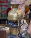 Brass tea making pot on charcoal Royalty Free Stock Photo