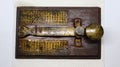 A brass telegram used for communications during second world war using Morse code encryption.