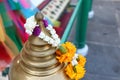 Brass top pillar and flower garland.