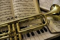 Trumpet and sheet music on piano keyboard Royalty Free Stock Photo