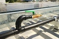 Brass Water Faucet with Thermal Welding Type HDPE Pipe on Roof for Solar Panel Cleaning Royalty Free Stock Photo