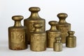 Brass weights (2kg, 1kg, 500g, 200g, 100g) Royalty Free Stock Photo