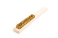 Brass Wire brush wish wooden handled on white background.