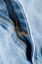 Brass zipper on blue jeans Royalty Free Stock Photo