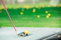 The brassy is near the yellow golf bal Royalty Free Stock Photo