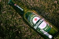 BrasÃÂ­lia, Federal District - Brazil. June 18, 2019. Photographed a bottle of Heineken beer on the lawn with light effect.