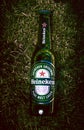 BrasÃÂ­lia, Federal District - Brazil. June 18, 2019. Photographed a bottle of Heineken beer on the lawn with light effect.