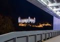 Bratislava Castle at Night Framed by Modern Bridge Royalty Free Stock Photo