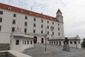 Bratislava, Slovakia - April, 2011: cloudy sky, knight statue and entrance of Bratislava Castle.