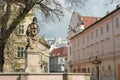 Bratislava, Slovakia - April, 2011: fountain `Woman with jar` on Hlavne square and Frantiskanske street view.