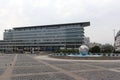 Bratislava, Slovakia - April, 2011: pigeons, globe monument and Tatra bank on Hodzovo square.