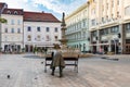 BRATISLAVA, SLOVAKIA - AUGUST 20 2018: Bronze statue of a soldier leaning on main square in Bratislava Royalty Free Stock Photo