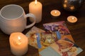 Bratislava, Slovakia, February 2, 2017: illustrative and editorial tarot cards and burning candle on wooden table Royalty Free Stock Photo