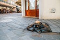 Cumil man at work statue at old town in Bratislava, Slovakia