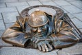 Bratislava, Slovakia - March 2016: Famous bronze sculpture of `Cumil, The Watcher`, by by Viktor Hulik