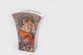 Bratislava, Slovakia - March 21, 2021: Illustration of woman by Alphonse Mucha on a vase