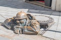 Cumil man at work statue in old town of Bratislava Royalty Free Stock Photo