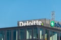 Logo and sign of Deloitte