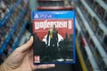 Man holding Wolfenstein 2: The New Colossus videogame
