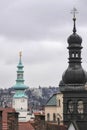 Breathtaking view of two clock towers against a cloudy sky in Bratislava, Slovakia.