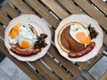 Bratwurst Sausage German Breakfast with Pancake, Fried Eggs and Mushrooms. Royalty Free Stock Photo