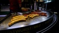 Bratwurst Sausage Grilling On A Streetfood Cart In Downtown Vienna At Night, Austria Royalty Free Stock Photo