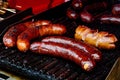 Bratwurst sausages on cast iron griddle. Royalty Free Stock Photo
