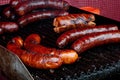 Bratwurst sausages on cast iron griddle. Royalty Free Stock Photo