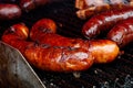 Bratwurst sausages on cast iron griddle. Royalty Free Stock Photo