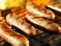 Bratwursts on grill with corn Royalty Free Stock Photo