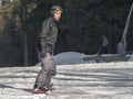 Braunlage, Germany - 15 Februar 2015: Winter sports holiday for the family. Young man in helmet, with goggles, in ski suit is