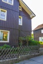 Braunlage Harz street with cars houses shops pedestrians mountains Germany