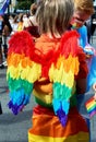 Back view of angel with wings in rainbow colors at CSD, Christopher Street day