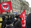 Antifa red flag over the heads of demonstrators at a rally against Nazis